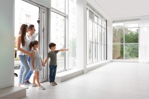 family inspecting house