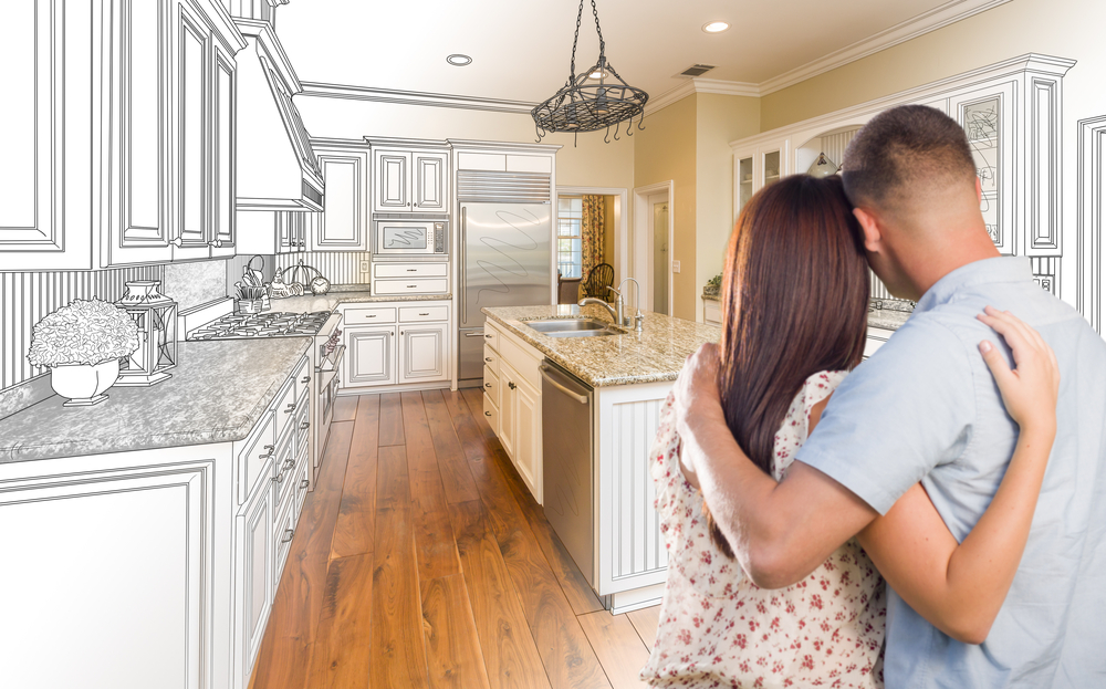 Young Couple Looking Inside Custom Kitchen and Design Drawing Combination